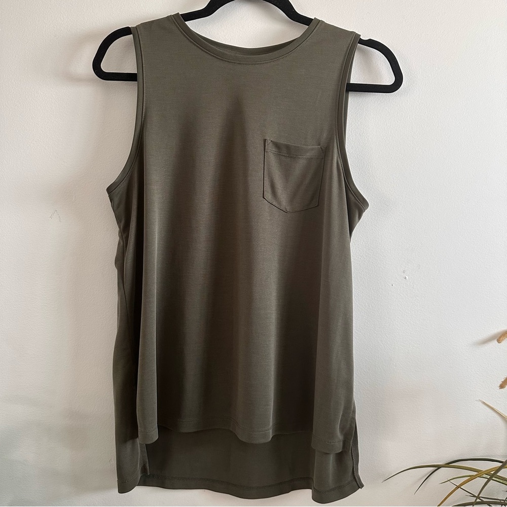 A new day brand olive tank top with pocket. Rounded hem.